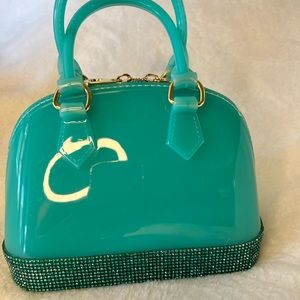 Cute jelly bag with sparkly edge! About the size of the LV Alma BB. Adorable 🥰